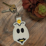 Faux leather embroidered Boo Bee keyring on wooden tray