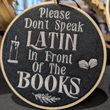 Please Don't Speak Latin In Front Of The Books Small Embroidered Hoop Wall Art