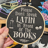 Please Don't Speak Latin In Front Of The Books Small Embroidered Hoop Wall Art