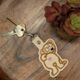 Faux leather embroidered pug butt keyring on wooden tray