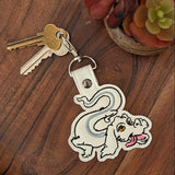 Close‑up of embroidered whimsical dragon creature keychain