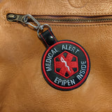 Faux leather medical alert keychains showing asthma, diabetes, epilepsy, autism, insulin, and epipen alerts